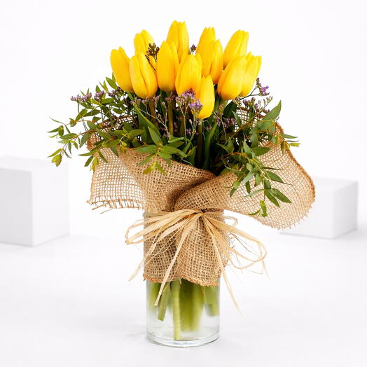 Vibrant tulips in a rustic vase
