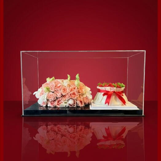 ACRYLIC CASE WITH DUMPLING CAKE AND FLOWER ARRANGEMENTS
