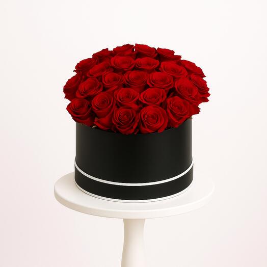 Red rose in a round box