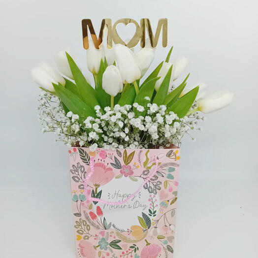 White tulips in hand bag