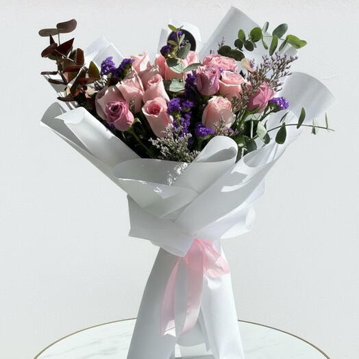 18 rosas rosadas y moradas