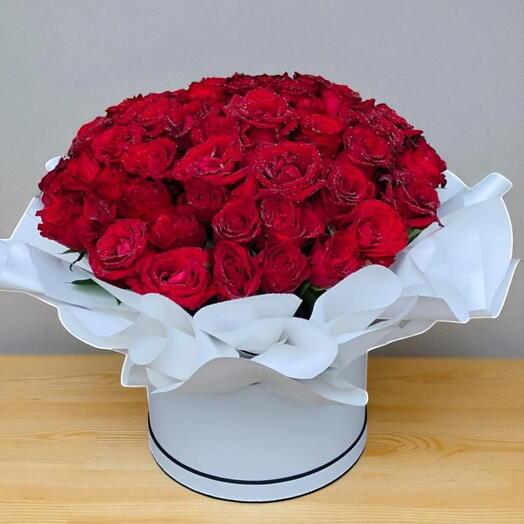 Red in White:60 Stems of red roses in a nicely arranged with paper in white round box