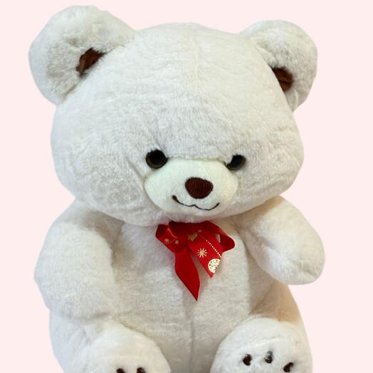 Белый плюшевый мишка