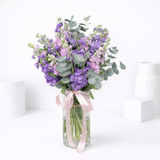 Blooming elegance 21 Stocks in glass vase