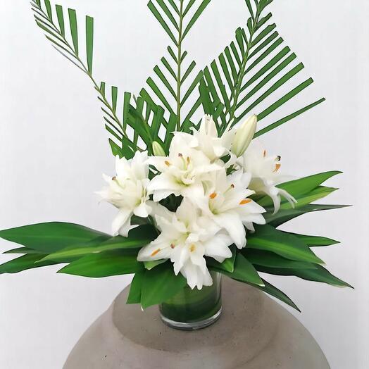 Elegant White Lily Vase Arrangement with Tropical Greens