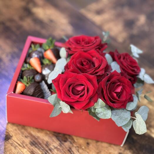 Strawberry and flowers in box