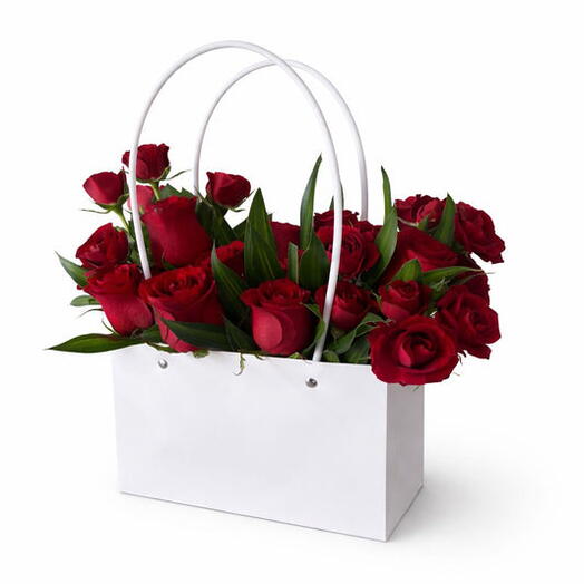 Flowers in basket with red rose and greens