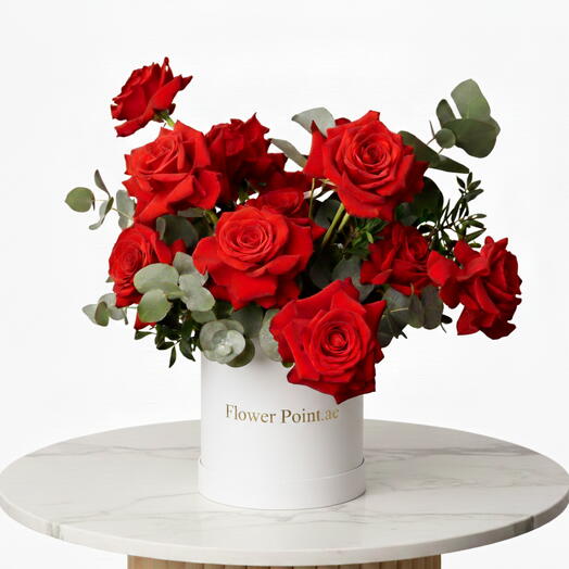 11 roses rouges dans une boîte