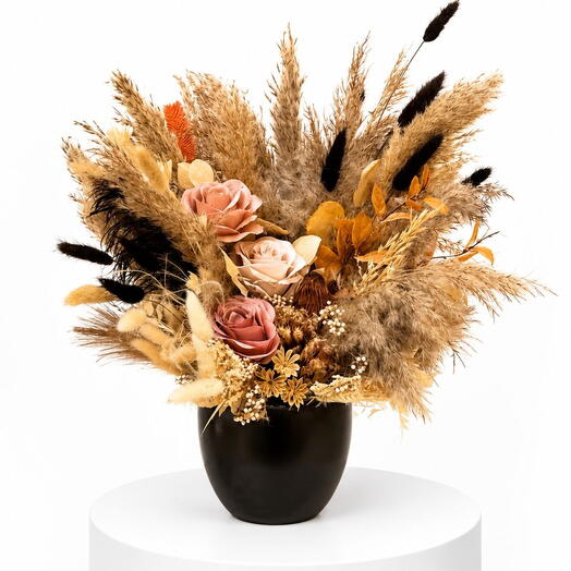 Dry flowers in the ceramic black vase