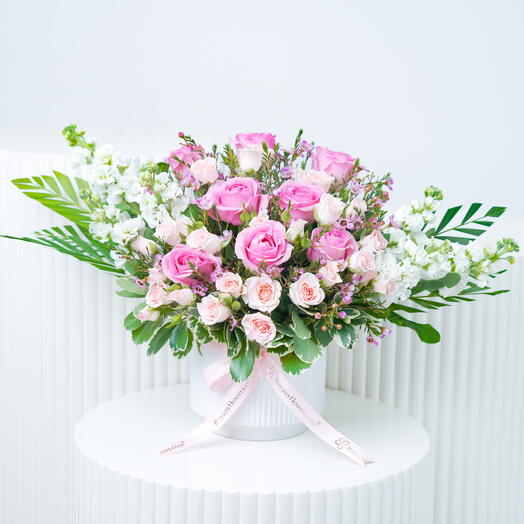 Blush Flowers in White Ceramic Pot