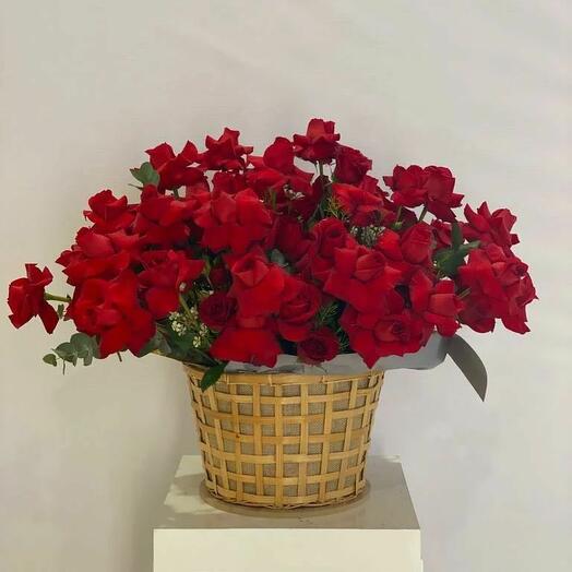 RED ROSES IN A BASKET