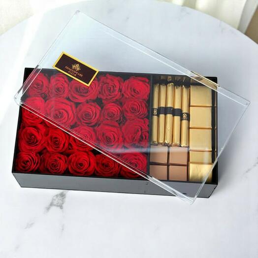 Caja de regalo con rosas rojas de lujo y chocolate belga – elegante arreglo de flores y dulces