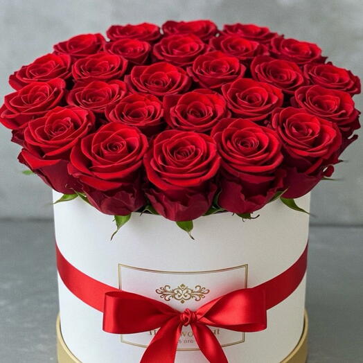 Flowers in a box with red ribbon