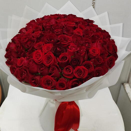 100 Red roses with white wrapping
