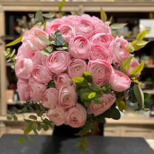 Bouquet of pink ranunculuses and greenery