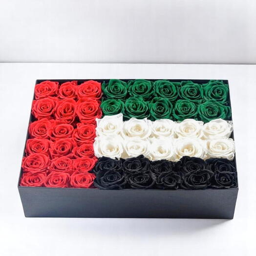 Caja homenaje de rosas con la bandera de los EAU