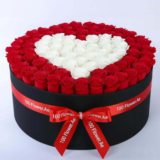 Boîte de 101 roses rouges avec cœur de roses blanches