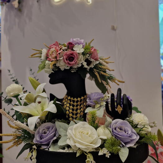 Wedding jewelery in fresh floral arrangement