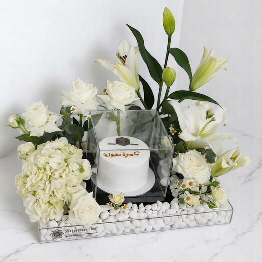 Blessed Umrah Flower and Cake Arrangement – White Roses, Lily   Hydrangea on Acrylic Stand