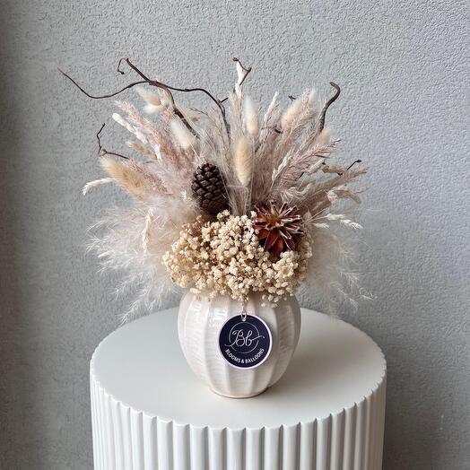 Mix of white dry flowers in ceramic vase