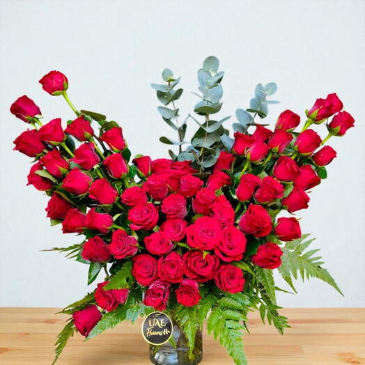 50 Stems of red roses beutifully arrange in a vase
