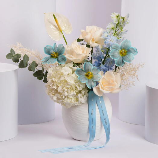 Elegant Blue and White Flower Arrangement in Ceramic Vase