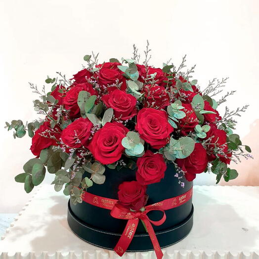 Gorgeous Red Mix: Fresh Red Roses, Eucalyptus Leaves, and Limonium in a Box