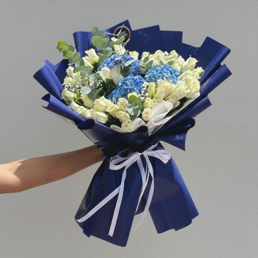 Azure Embrace | 3 Blue Hydrangeas   56 White Roses in Blue Wrap  Same-Day Dubai