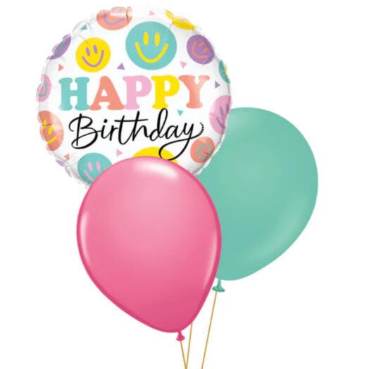 Настольная композиция из воздушных шаров с разноцветными смайликами на день рождения