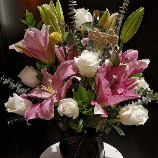 Black vase  with  flowers