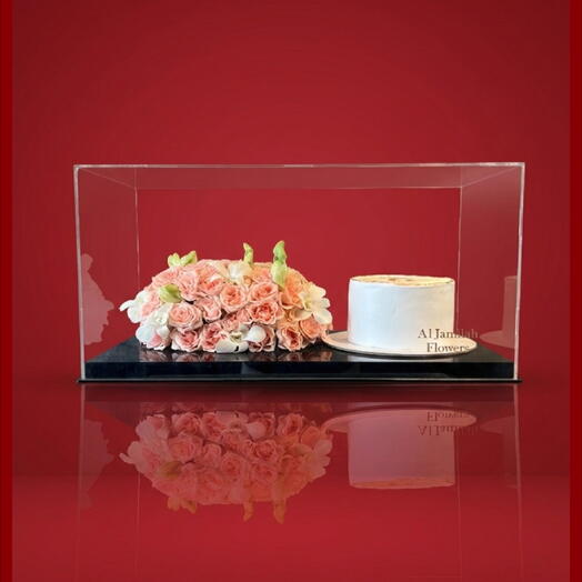 ACRYLIC CASE WITH CAKE AND FLOWER ARRANGEMENTS