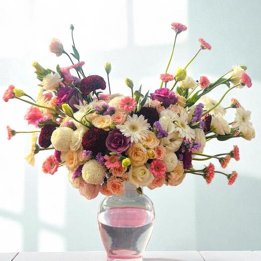 Elegant Bloom Symphony – Mixed Roses, Gerberas   Eustoma in Glass Vase