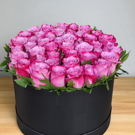 Round Purple Box Arrangement:An arrangement of 50 purple roses  in a round black box