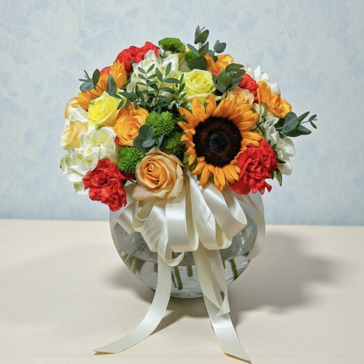 🌼 Vibrant Fishbowl Arrangement – Mixed Roses, Sunflowers   Carnations | Cheerful Flower Gift Dubai