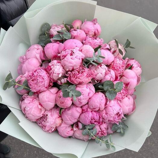 Bouquet of pink peonies and eucalyptus