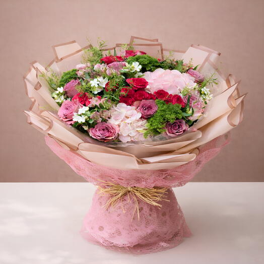 PINK BEAUTY Floral Arrangement: Oxypetalum White Flower, Pink Rose, Hydrangea, Spray Roses, and Trachelium Green