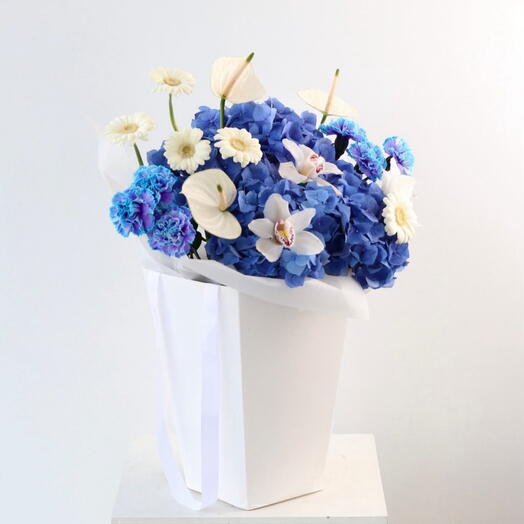 Power - A florist special of Blue hydrangea, carnations , Orchids and Daisy