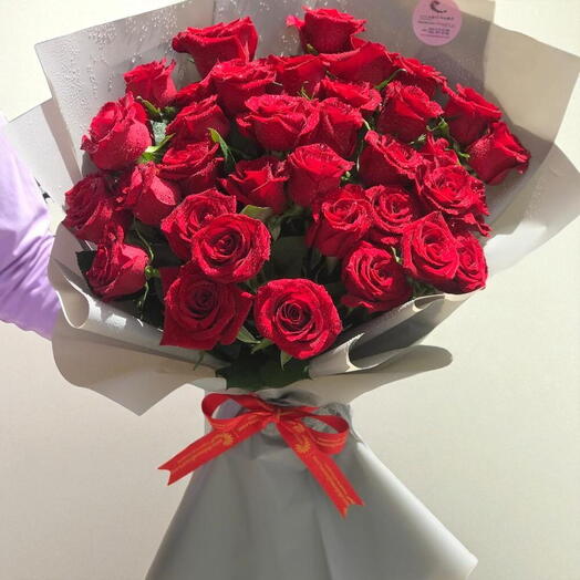 30 Stems of Red Roses in a brown wrapping