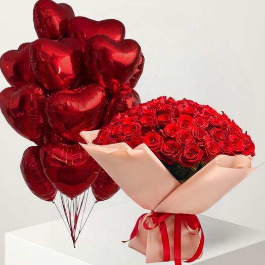 «Сердце королевы» — классический букет из 99 красных роз и 10 красных воздушных шаров в форме сердца. Роскошный подарочный набор для годовщины или дня рождения.