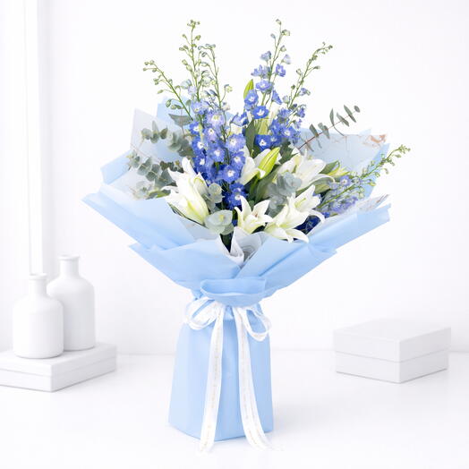 Elegant floral bouquet with lilies and delphiniums
