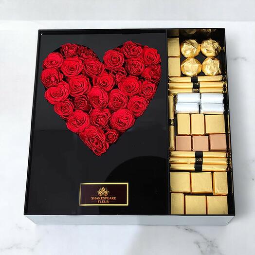 Caja Corazón VIP de Shakespeare Fleur: Bombones surtidos de rosas rojas en una lujosa caja de regalo acrílica.