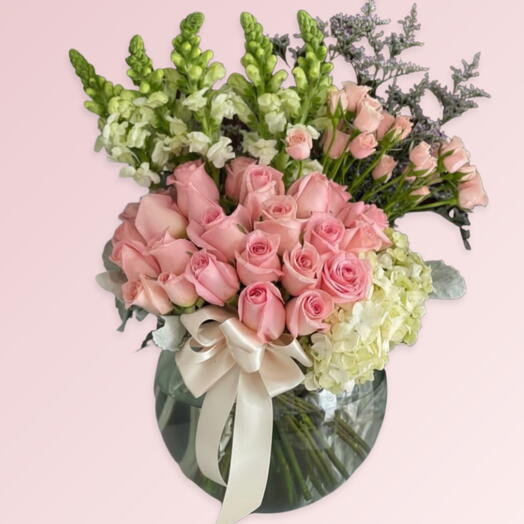 BLOOMING GRACE: hydrangea , pink roses , white mathiola , baby roses, lemonium, fish bowl
