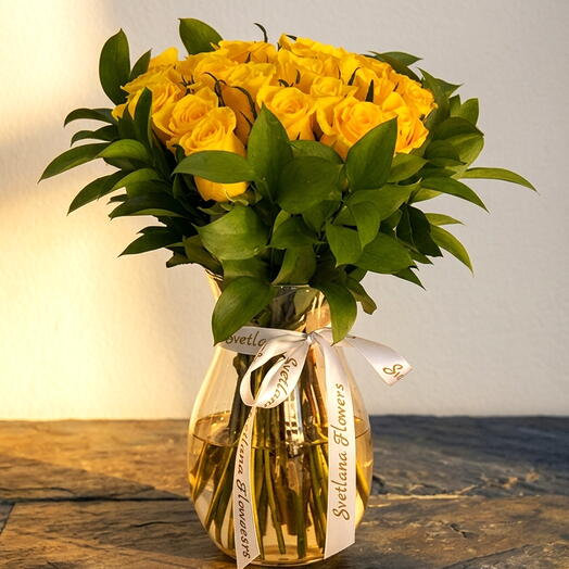 Send Sunshine 21 Yellow Roses in a Crystal Vase, Same Day Dubai