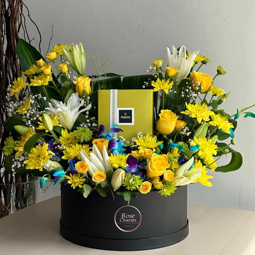 Patchi Deluxe Bloom Box | 500g Patchi Chocolates with Yellow Roses, Lilies   Blue Orchids  Same-Day Dubai