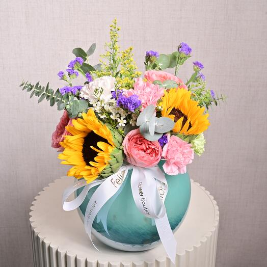 Delight Mixed Flowers in an Aqua Glass Vase  7008