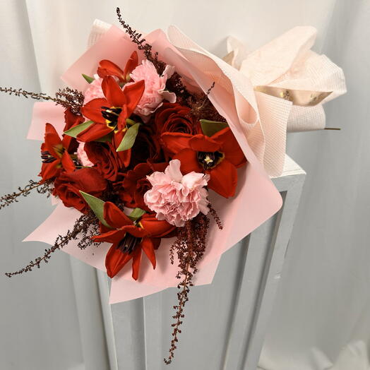 Red roses with red tulips and pink carnation bouquet